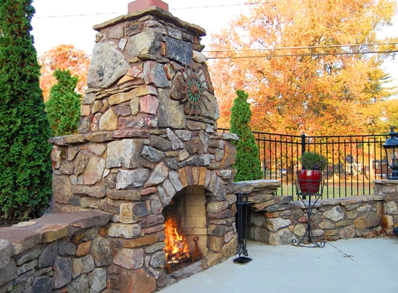 French Masonry - Imperial, MO. Stone fireplace, natural rock retaining wall and outdoor fireplace.