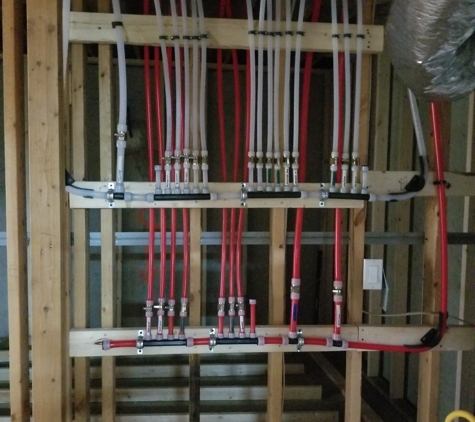 Pinnacle Plumbing Service. Water manifold, single line run to each fixture with individual shut off in basement.