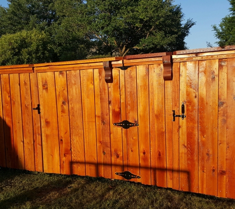 JM Fences - North Richland Hills, TX. Double gate and a single gate.  Stained cedar.