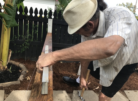 Curry Construction - Sacramento, CA. Pat making sure the fence is level