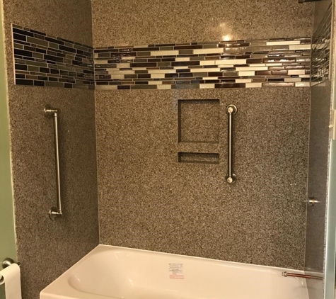 Granite Transformations of Little Rock - North Little Rock, AR. Amazing New Alcove Tub Shower included grab bars, niche, aging in place upgrades, and ADA accessories.