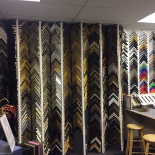 The Artery - Saint Louis, MO. Zigzag 3D frame sample wall holds twice as many frames as our old location.