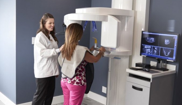 Dental Wellness Team - Coral Springs, FL. Dental hygienist with patient at Dental Wellness Team