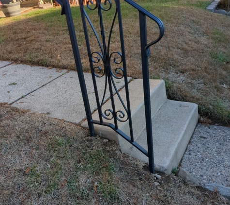 Anvil Iron Works - Philadelphia, PA. Here is the beautiful railing cemented next to the existing steps! We LOVE it!