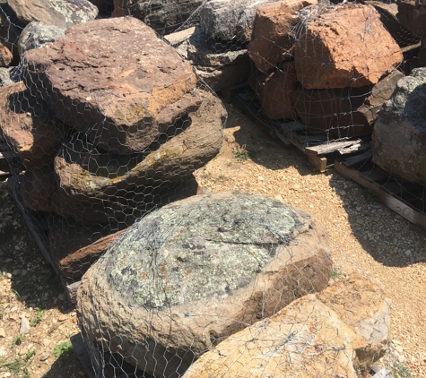 Brooks Stone Ranch - New Braunfels, TX. Landscape Moss Sandstone boulders