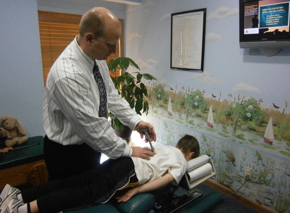 Staudenmaier Chiropractic Wellness Center, SC - Sturgeon Bay, WI. Dr. Luke adjusting a child