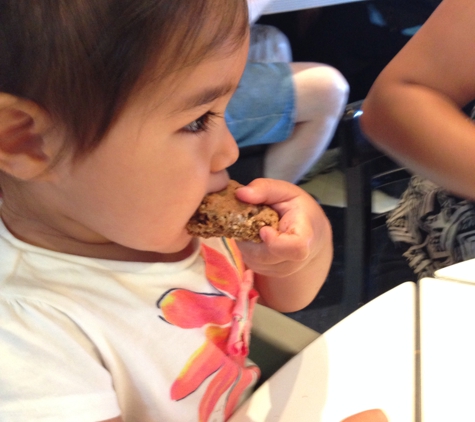 Saul's Restaurant & Delicatessen - Berkeley, CA. My daughter enjoying her oatmeal raisin cookie.