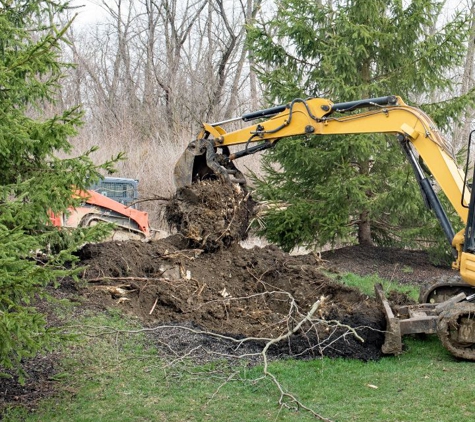 Bombace Construction - New Rochelle, NY. Pulling a tree root