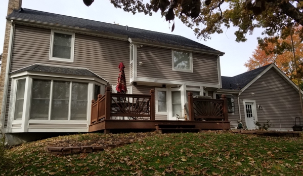 Barr Roofing & Exteriors. Rear of home - new roof and siding. 