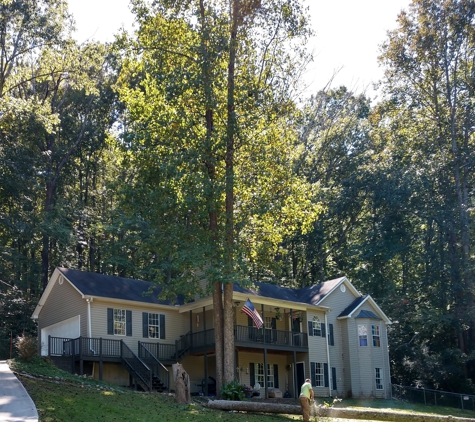 Rays affordable tree service - Gainesville, GA. Large Popular that was leaning to the house, and Ray got it down into the yard the opposite direction of the lean.