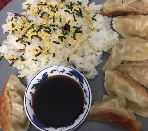 SJ's International Food Market - Dunedin, FL. Gyoza with botan rice and egg futikaki!