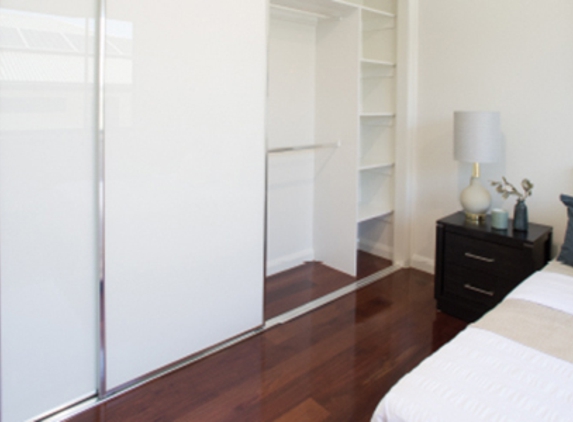 Bradnam's Windows & Doors - Mount St John, QLD. Sliding Wardrobe Door In Bedroom