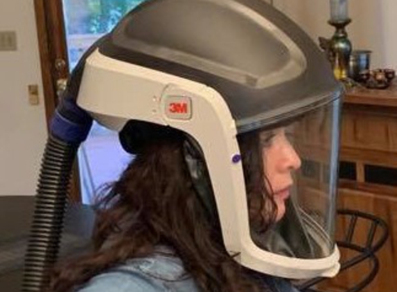 Flor Banks, Licensed Massage Therapist - Fairbanks, AK. Using Powered Air Purifying Respirator during appointments to protect clients from COVID-19