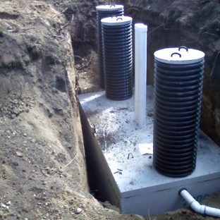 Jim's Excavating & Pumping, LLC - Cologne, MN. Tank Installation with Dualwall Risers and Manhole Covers