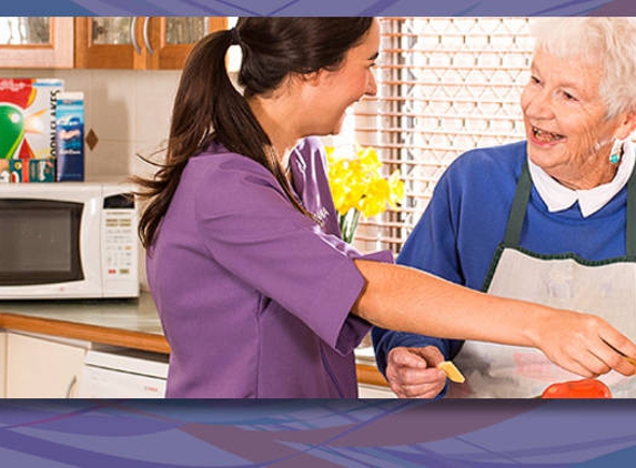 Amana Living Treendale - Australind, WA. A resident with her carer preparing food in the kitchen