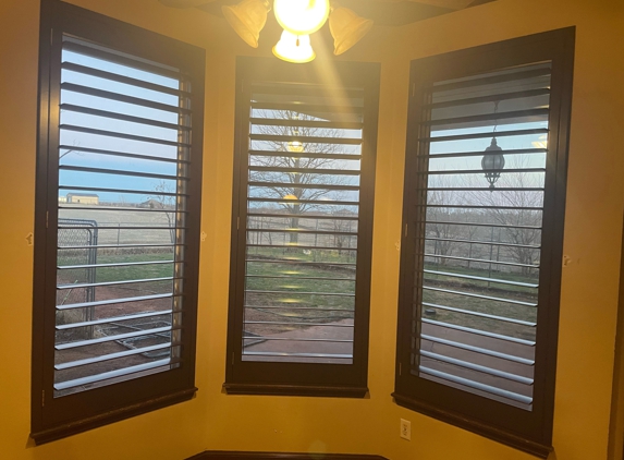 Kirtz Shutters - Stillwater, OK. Stained shutters matching existing frames in a kitchen.