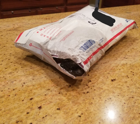 United States Postal Service - Harker Heights, TX. Wet and ripped package that was crammed into our mailbox!