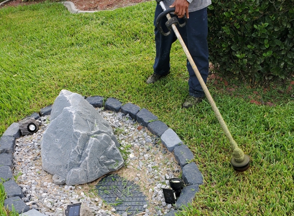 Luis Sanchez Lawn Care - Bradenton, FL. Look how he knocked the metal fixture sideways. That is my property!!