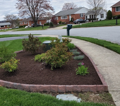 Frada Landcaping LLC - newark, DE. Edge stone installation with new flowers and mulch