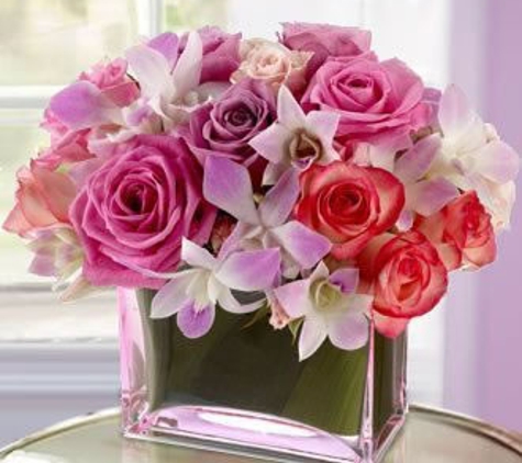 Miami Beach Flowers®, a Surf Florist, Inc Company - Miami Beach, FL. Rose and Orchid Centerpiece