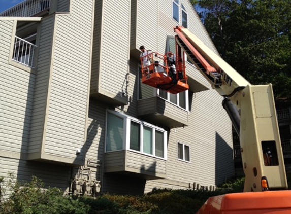 Painting Services of West Michigan - Spring Lake, MI. Scissors lift for painting residential exterior in West Michigan