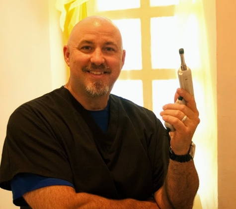 Dr. Donald H. Dearth, DC - Tempe, AZ. Dr. Dearth holding an Impulse instrument on a medial mission trip to Armenia in 2009