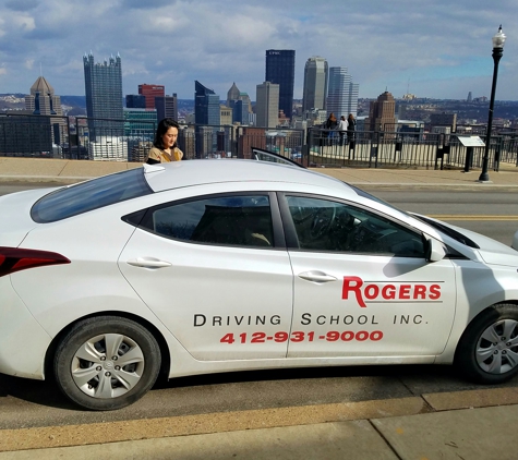 Rogers Driving School Inc. - Pittsburgh, PA. Rogers Driving School training vehicle parallel parked on Grandview Drive overlooking Pittsburgh.