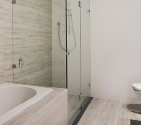 Bradnam's Windows & Doors - Warana, QLD. Frameless Shower Screen Next To A Bath