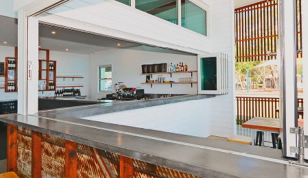 Bradnam's Windows & Doors - Bungalow, QLD. White Aluminium Bi-fold Windows
