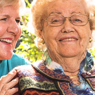 Amana Living - Subiaco, WA. A resistent with her carer outdoors