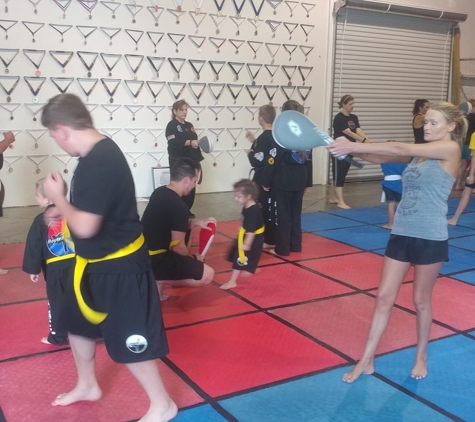 Boyer Academy - Troy, MO. Derrick doing his roundhouse kick. This was on Mother's Day. All us moms did class with or kid/kids and received a flower afterwards