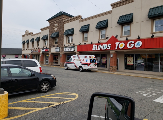 Cardinal Ambulance Corp - Totowa, NJ. If anyone needs an Ambulance,  stop by the bagel shop in Totowa, they will help you after done with breakfast.... PARKED IN THE FIRE LANE!!!