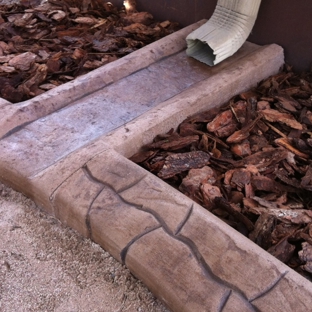 Coastal  Curbing Designs - Largo, FL. New customized gutter drainage.  Keeps yard neat