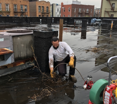 24 Hour Air Conditioning, Plumbing, Sewer and Drain - Freeport, NY. Snaking out 4" stack line from roof vent.