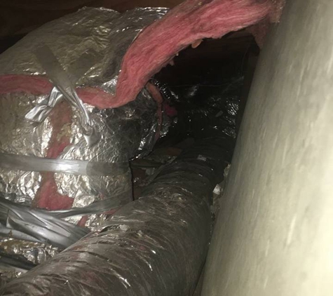 Bell Air Conditioning - Irving, TX. Shoddy duct work. Photo taken by another contractor to show me how bad the job was done.