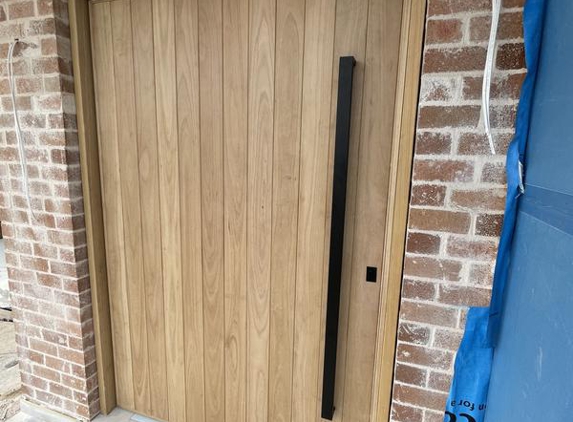 MJ Carpentry and Joinery - Westmead, NSW. Mighty 2.4 x 1.4 metre, 66mm thick, solid black butt, steel reinforced, hydraulic pivot door, with specialty architectural hardware.. $7000 all inc!