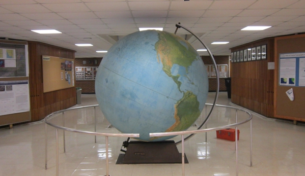 Universal Fine Art Conservation - Hilton Head Island, SC. Before restoration.  Rare Rand McNally Monumentally sized globe at the University of Georgia, Athens.  Map was damaged stained and faded. 