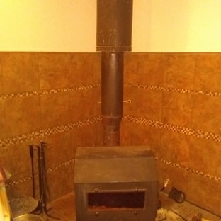 Bud's Handyman Service - Winchester, VA. tile wall to serve purpose to keep the heat from the wall from the woodstove 