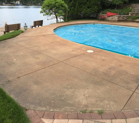 Above & Beyond Tree and Shrubbery Service - South Bend, IN. Pressure cleaning pool deck area