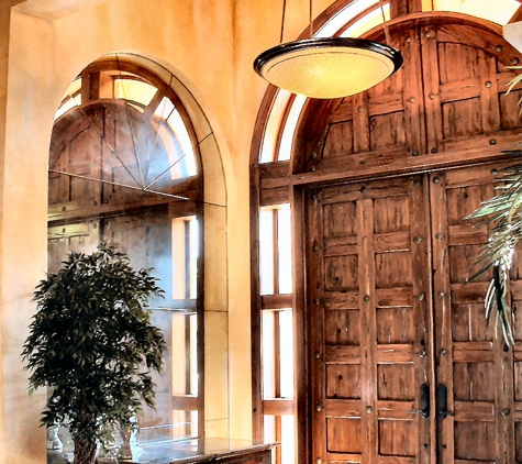 Integral Design Interiors - New Hope, PA. Arched wood doorway in entry foyer