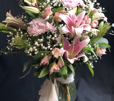 Garlands of Grace - Palmer, AK. Lilies and chrysanthemums in soft pastels create an atmosphere of romance.