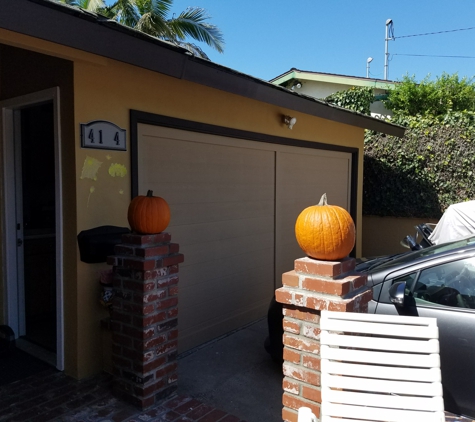 Paintology Quality Painting - Imperial Beach, CA. Repair eaves and reface garage door and paint after picture